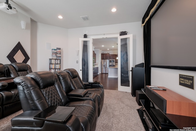 carpeted cinema with french doors