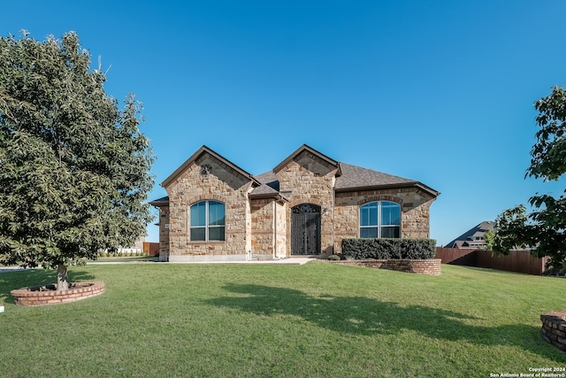 view of front of home with a front yard