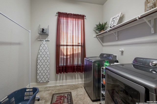 laundry area featuring washing machine and clothes dryer