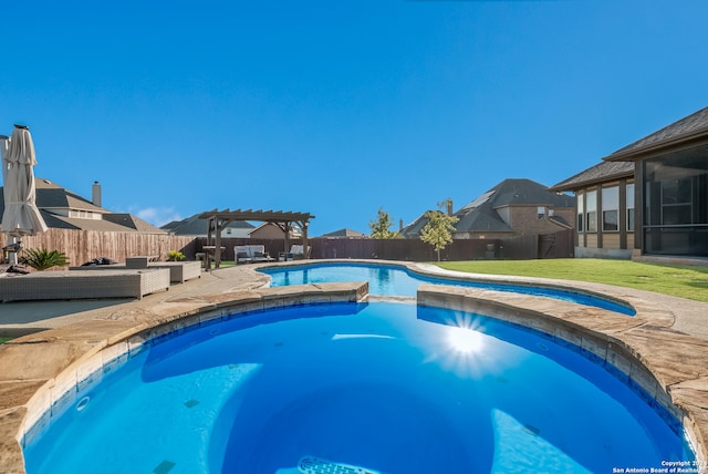 view of swimming pool with a pergola and a sunroom