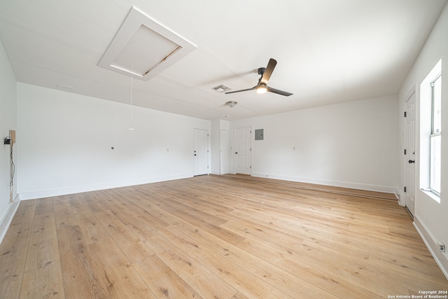 unfurnished room with ceiling fan and light wood-type flooring