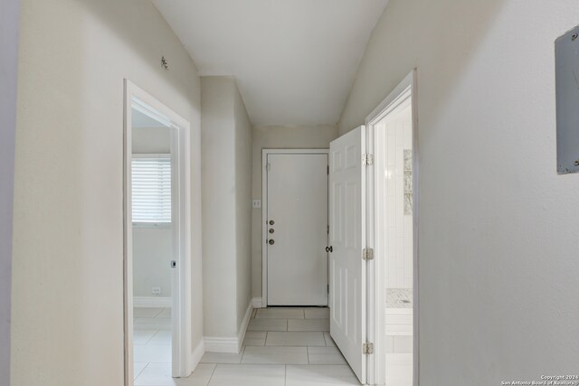 hall featuring light tile patterned floors