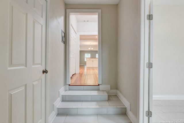 stairs featuring tile patterned floors