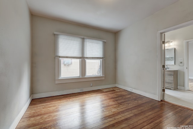 empty room with wood-type flooring