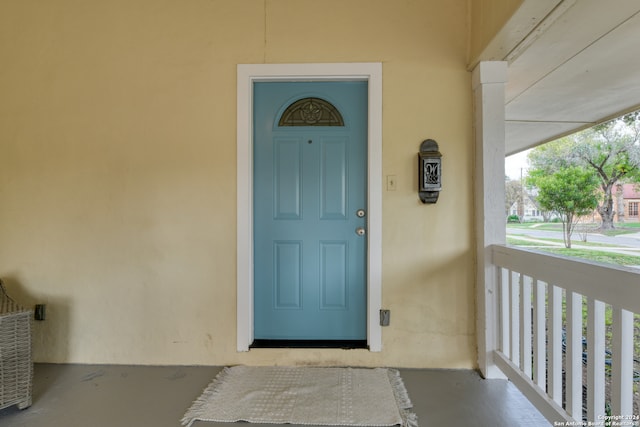 doorway to property featuring a porch