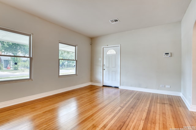 empty room with light hardwood / wood-style floors