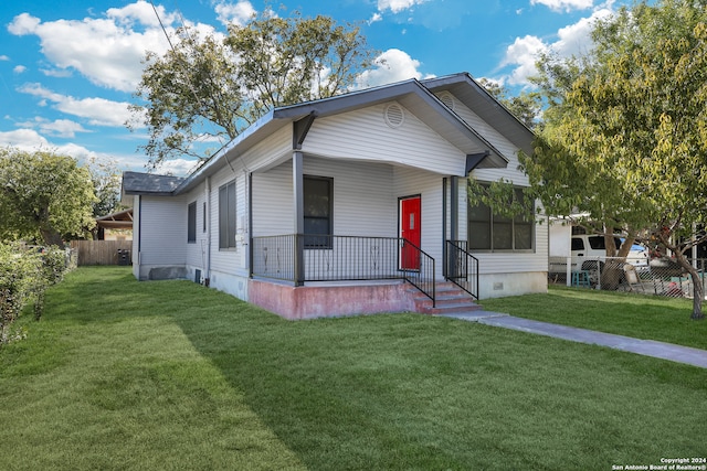 view of front of home featuring a porch and a front yard