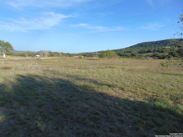 view of mountain feature with a rural view