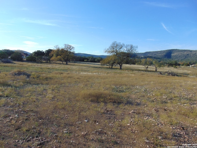 view of mountain feature with a rural view