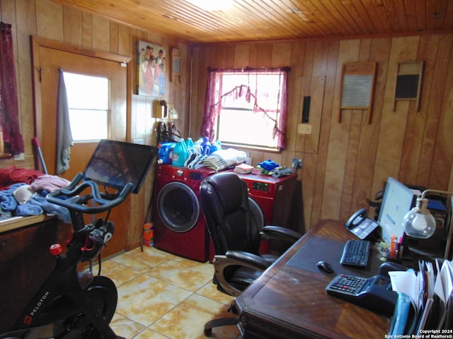 office space featuring wood walls, light tile patterned flooring, wood ceiling, and separate washer and dryer