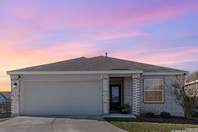 ranch-style home with a garage