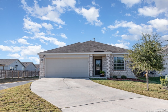 view of front facade with a garage and a front yard