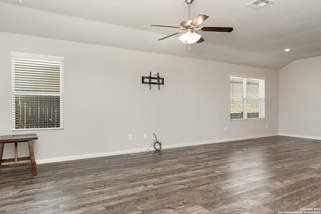 empty room featuring ceiling fan, dark hardwood / wood-style flooring, and lofted ceiling