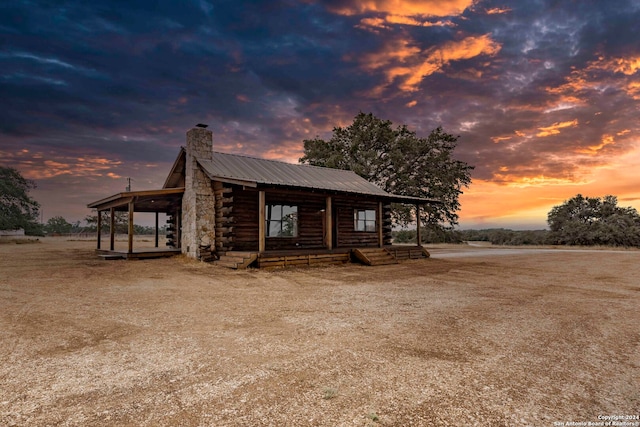 view of log cabin