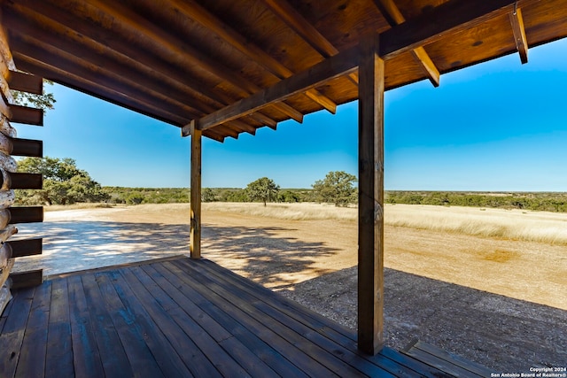 wooden deck featuring a rural view