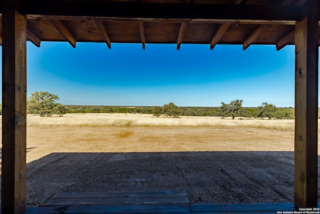 view of yard with a rural view