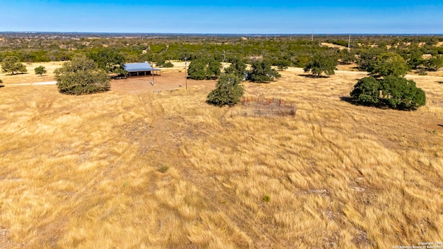 birds eye view of property featuring a rural view