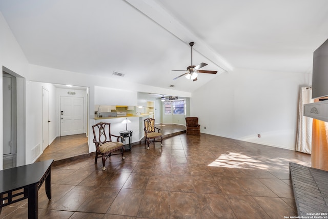 living room with vaulted ceiling with beams and ceiling fan