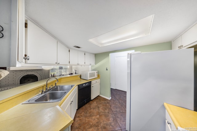 kitchen featuring a fireplace, white cabinetry, white appliances, and sink