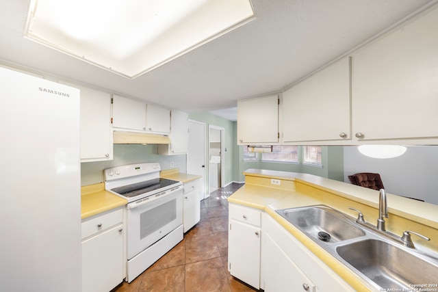 kitchen featuring washer / clothes dryer, white cabinetry, sink, and white appliances