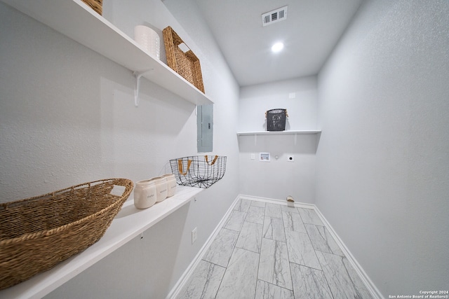 washroom featuring electric dryer hookup, electric panel, and hookup for a washing machine