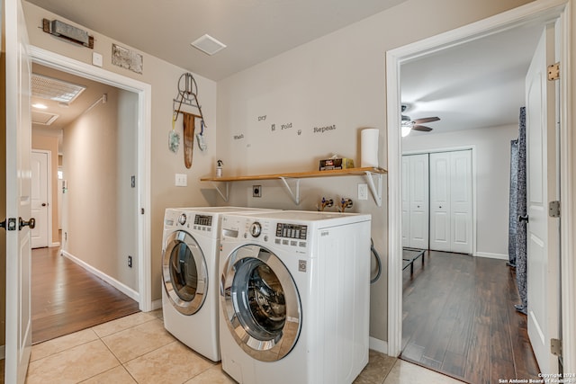 laundry room with washer and clothes dryer, ceiling fan, and light wood-type flooring