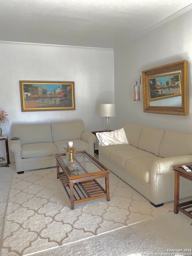 carpeted living room featuring ornamental molding