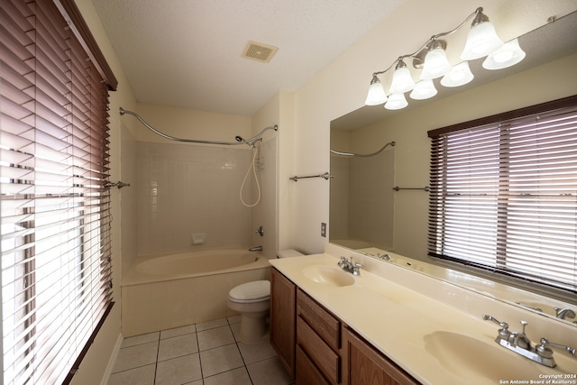 full bathroom with vanity, a textured ceiling, bathing tub / shower combination, tile patterned flooring, and toilet