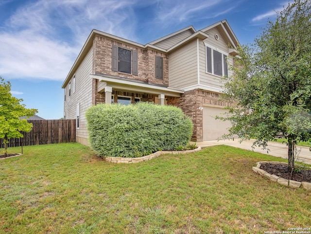 view of front facade with a garage and a front lawn