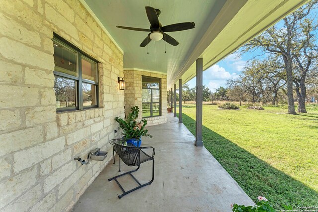 view of patio featuring ceiling fan