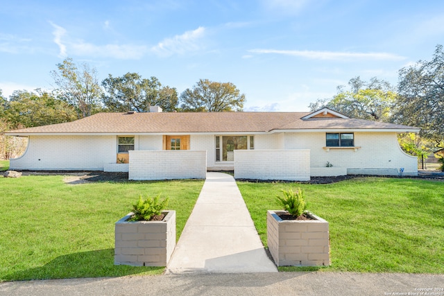 ranch-style house with a front yard