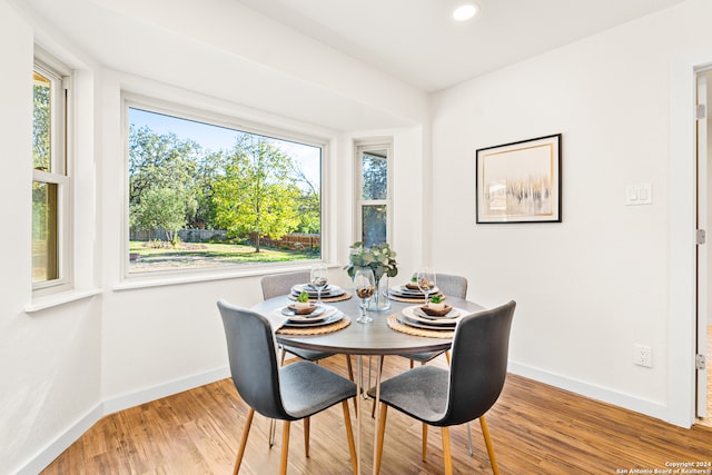 dining area with hardwood / wood-style flooring