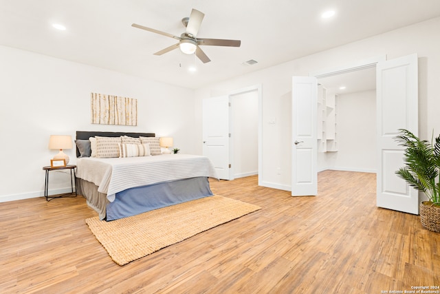 bedroom featuring light wood-type flooring and ceiling fan