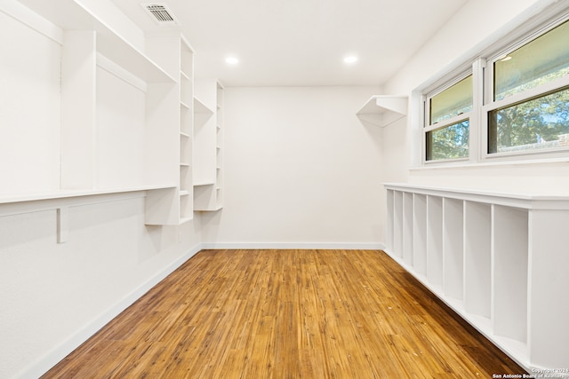 walk in closet featuring light hardwood / wood-style floors