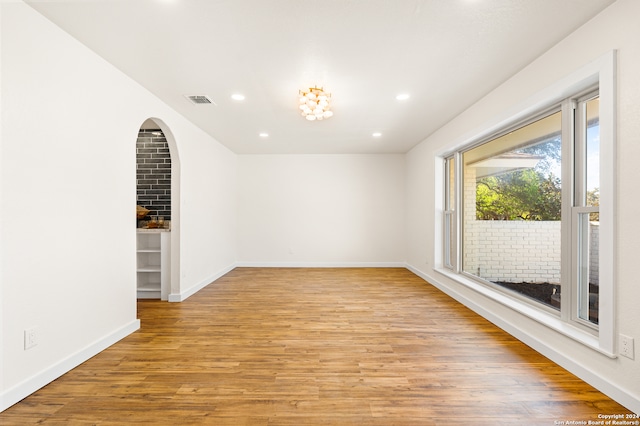 empty room with light hardwood / wood-style flooring