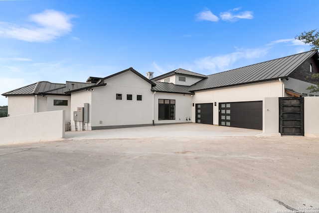 modern inspired farmhouse with a garage