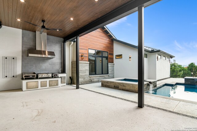 exterior space featuring an outdoor kitchen, pool water feature, ceiling fan, a swimming pool with hot tub, and a patio area