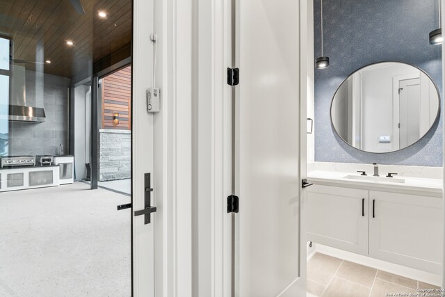 bathroom with vanity and tile patterned floors