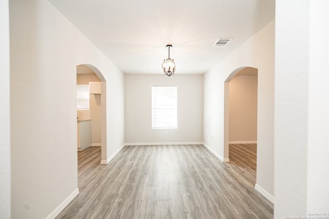 unfurnished room featuring light hardwood / wood-style floors