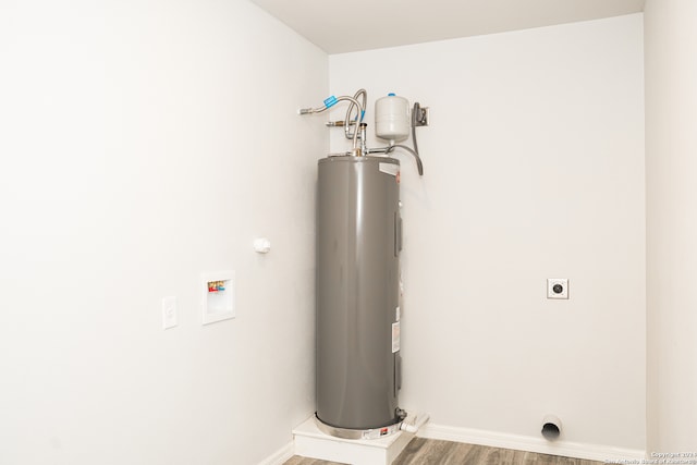 utility room with electric water heater