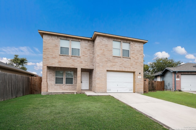 view of property featuring a front yard and a garage