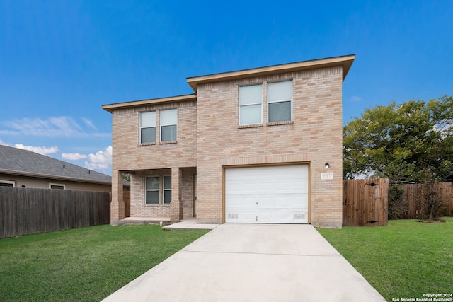 view of front of house with a garage and a front yard