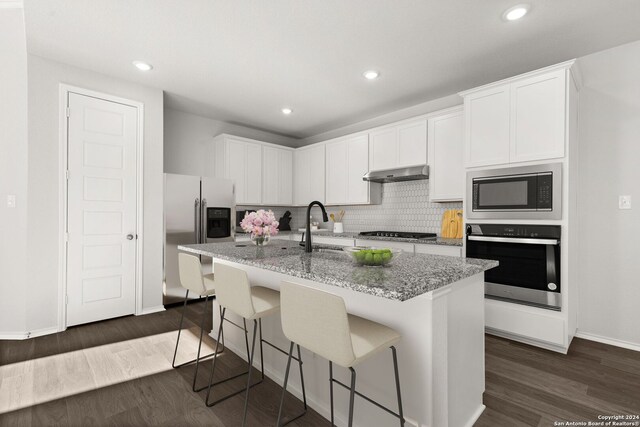 kitchen featuring a kitchen island with sink, white cabinetry, stainless steel appliances, and exhaust hood