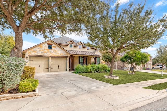 craftsman inspired home with a front lawn and a garage