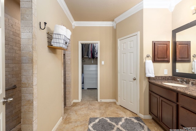 bathroom featuring vanity, tile patterned floors, and crown molding