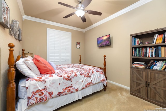 carpeted bedroom featuring ceiling fan and crown molding