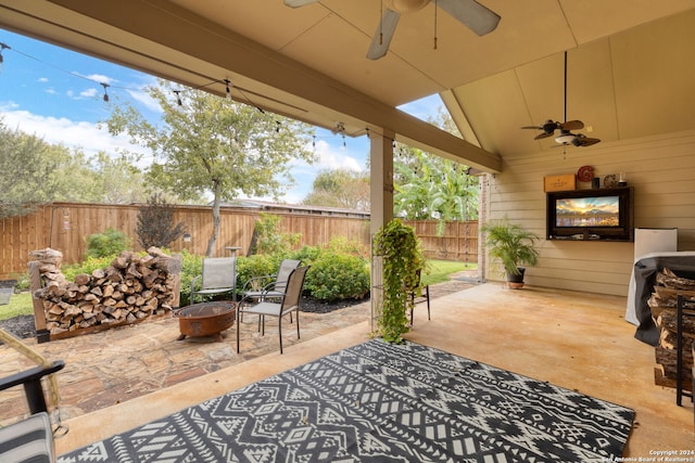 view of patio / terrace featuring a fire pit and ceiling fan