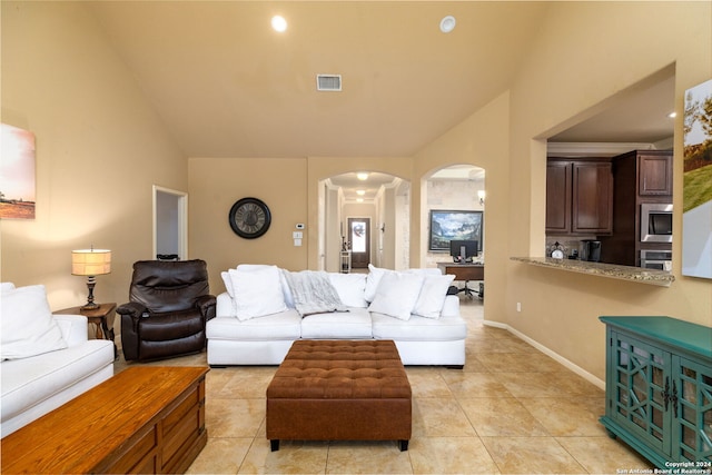 tiled living room featuring lofted ceiling