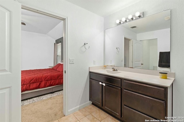 bathroom with tile patterned floors and vanity