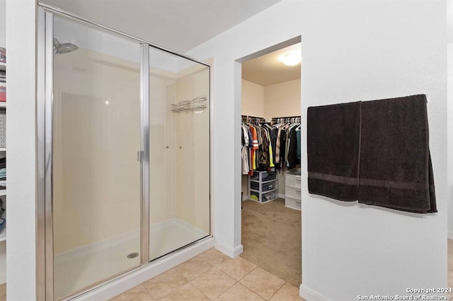 bathroom featuring tile patterned floors and walk in shower